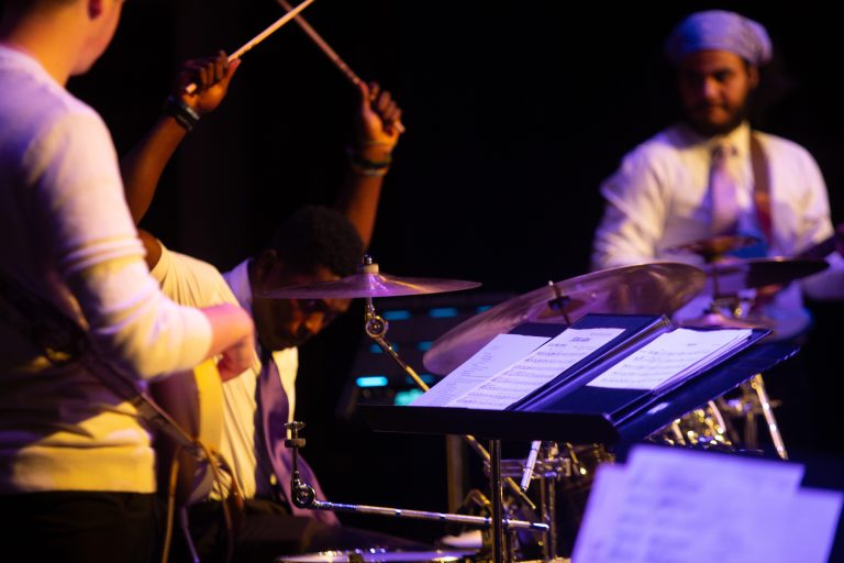 student playing drums with lavender jazz