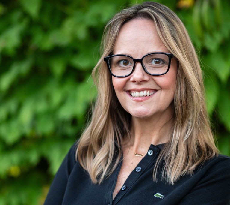 shannan martin smiling against a green background