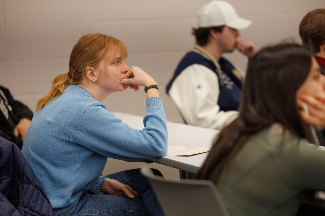 Student listening in audience