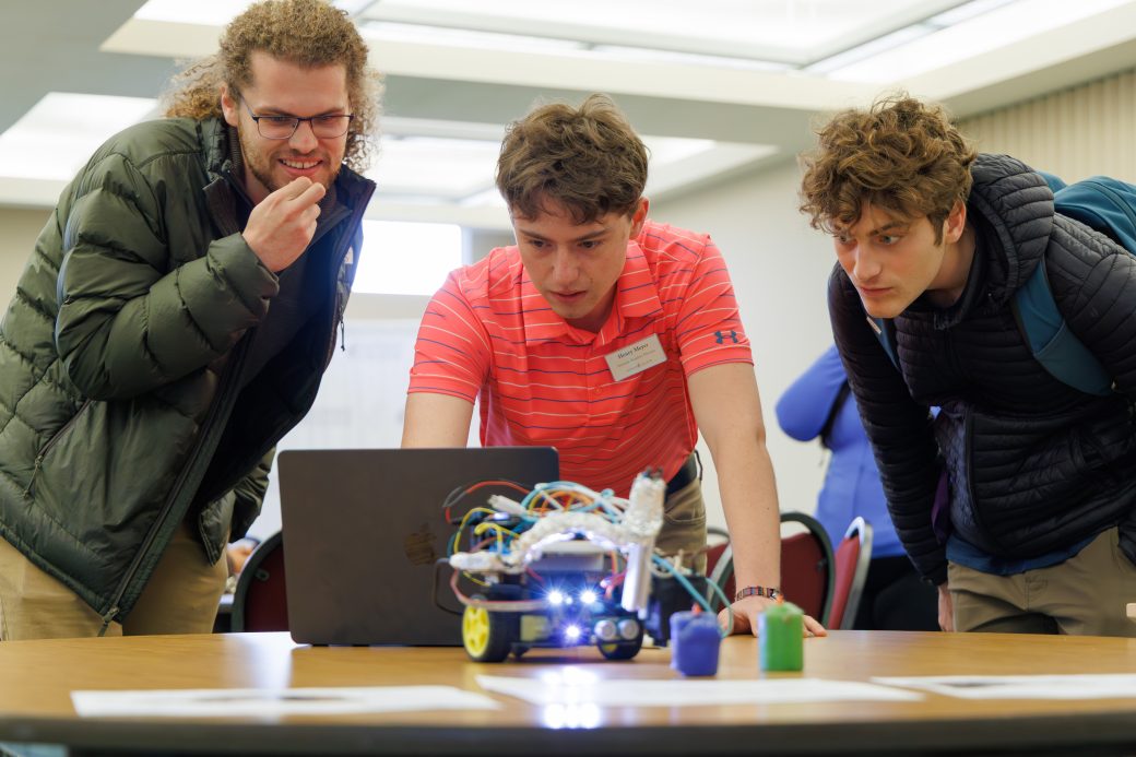 Students looking at computer