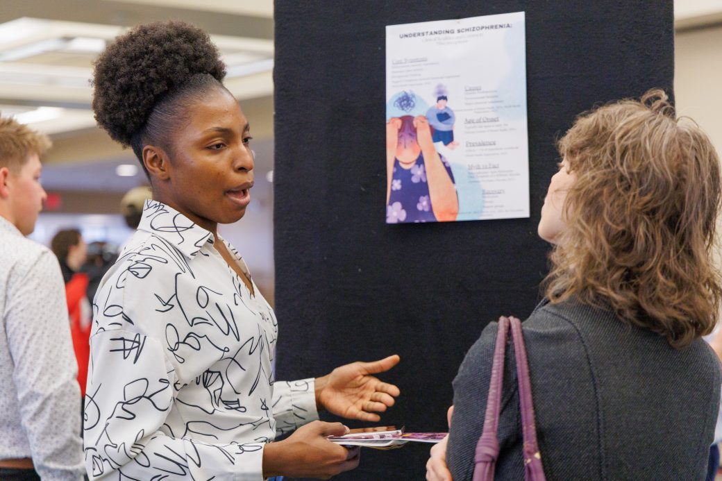 Student talking about poster