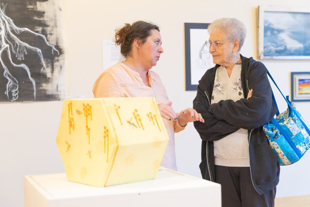 Community members talk about art