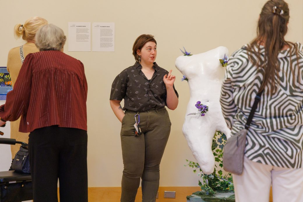 Senior art student talking about artwork