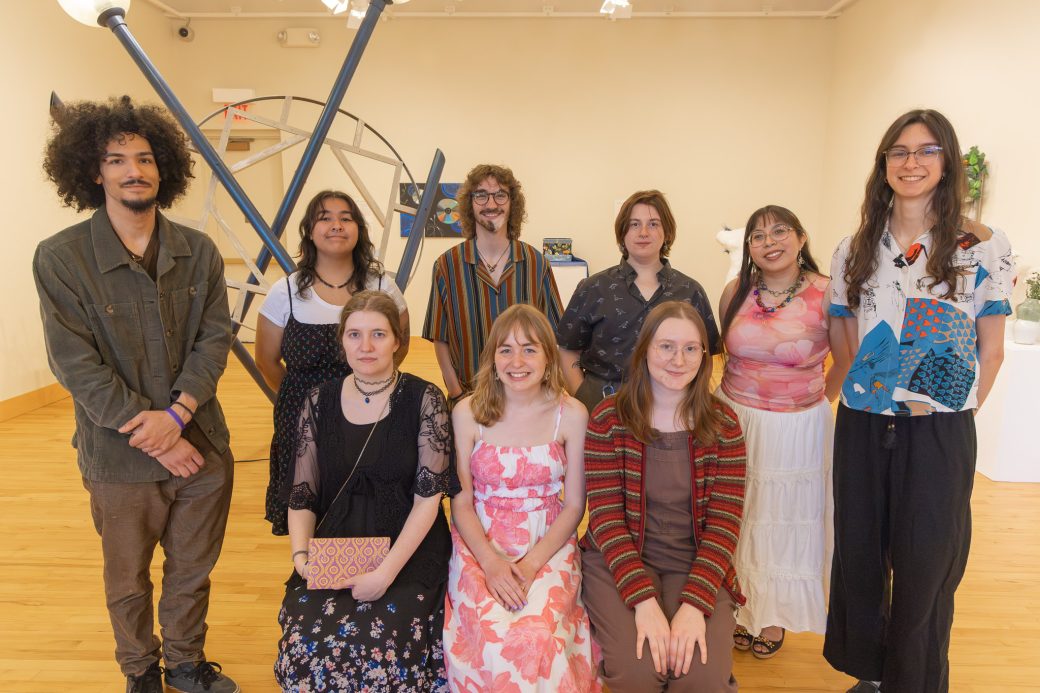 Art seniors posing for photo in art gallery