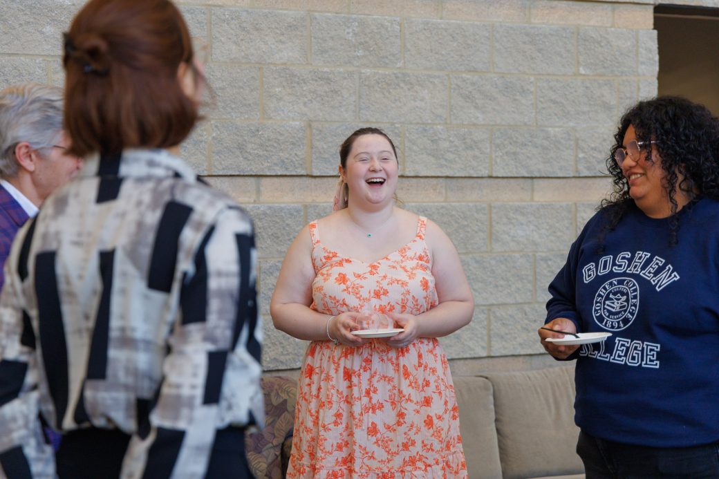 Student laughing in conversation