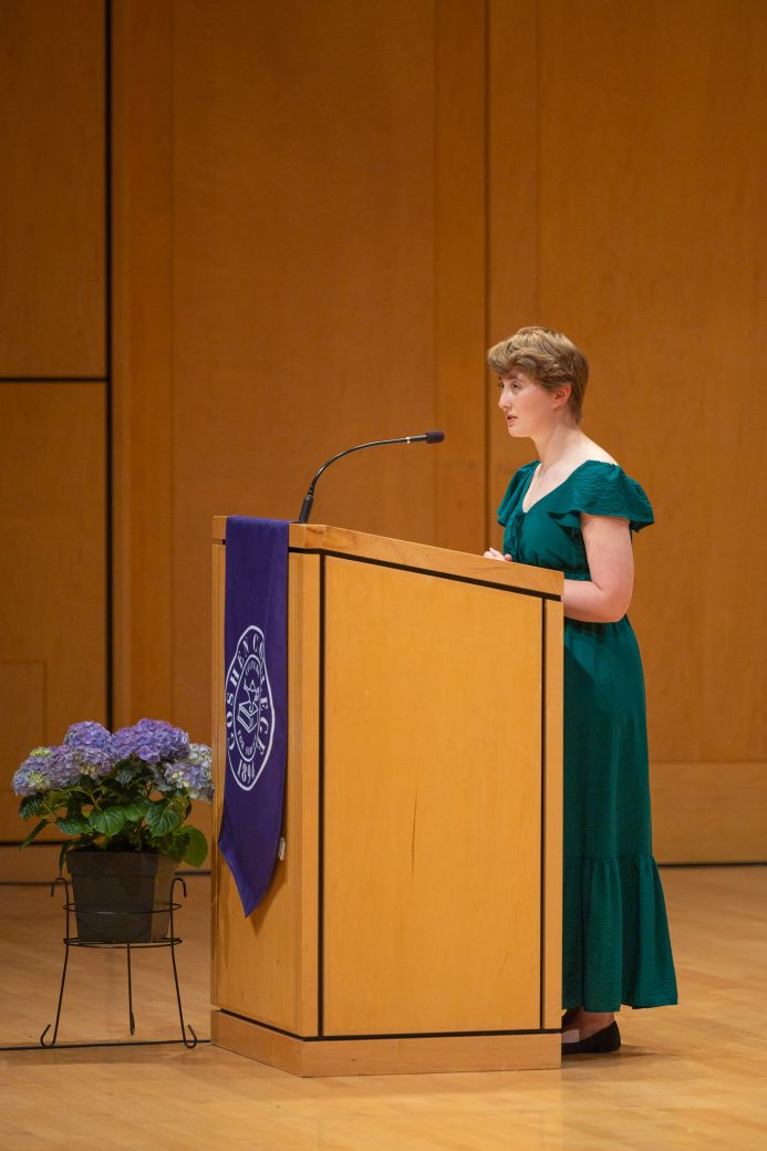 Student reads a poem during baccalaureate