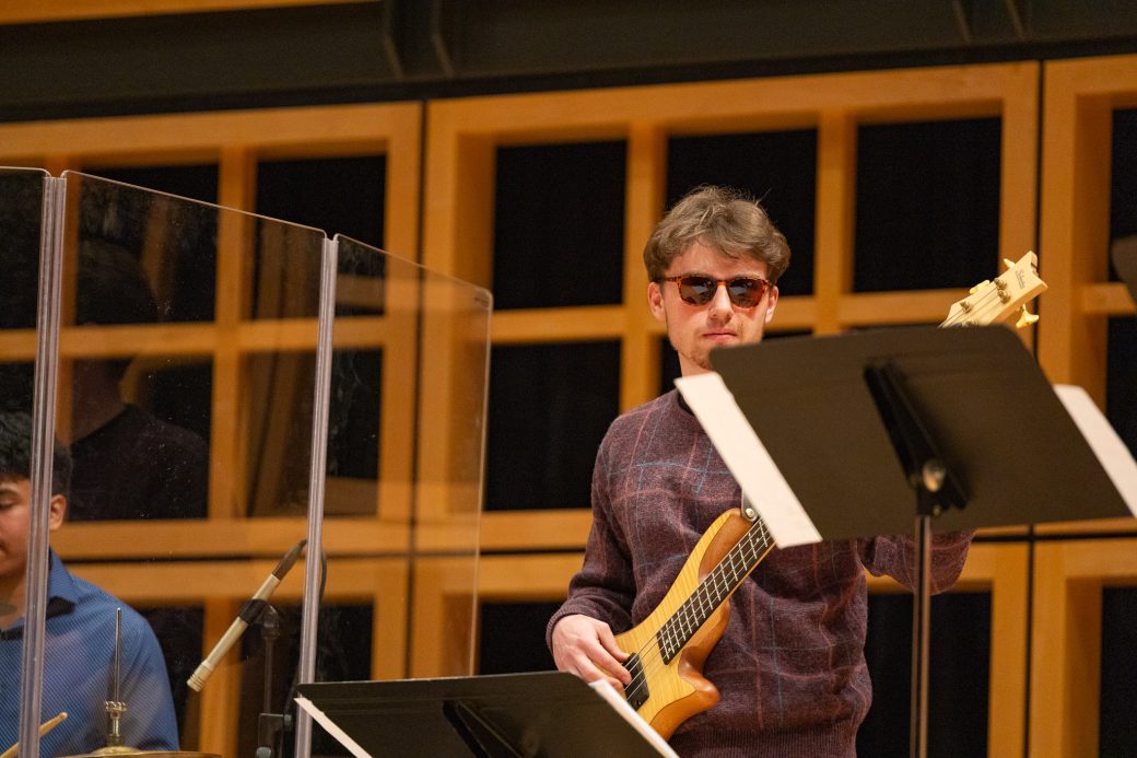 Guitar player grooving with sunglasses