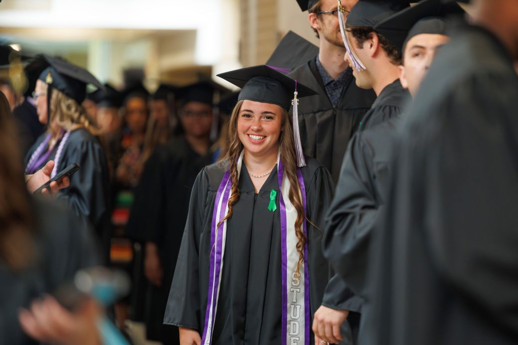 Female graduate student smiling
