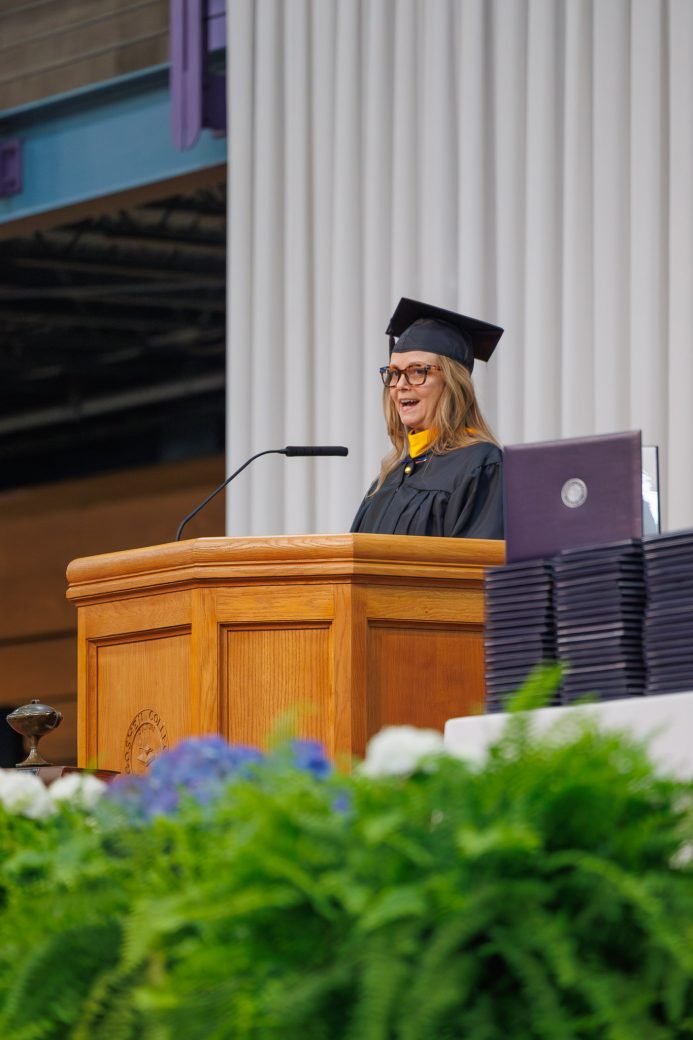 Shannan Martin at podium speaking during Goshen College graduation