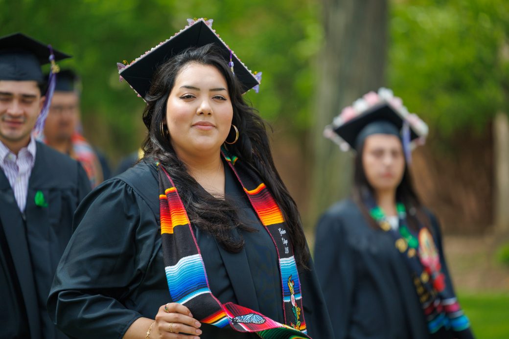 Latina graduate wearing a stole representing her heritage during commencement