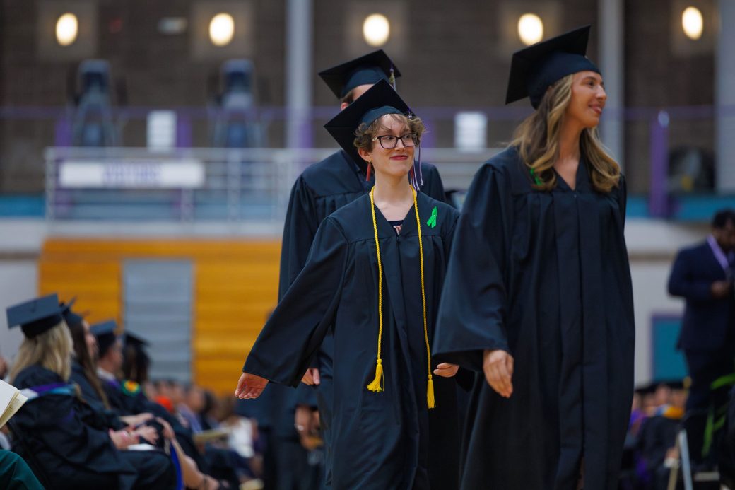Female graduate walking to get diploma