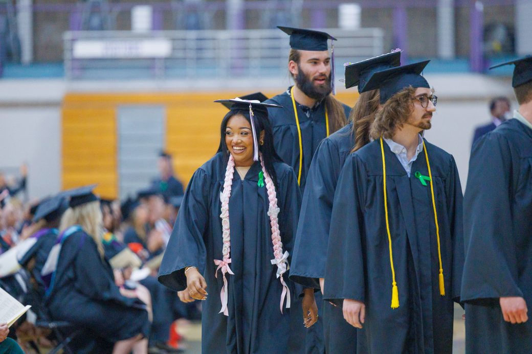 Graduates await their diploma