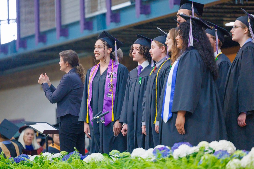 Group of students singing during benediction at commencement ceremony
