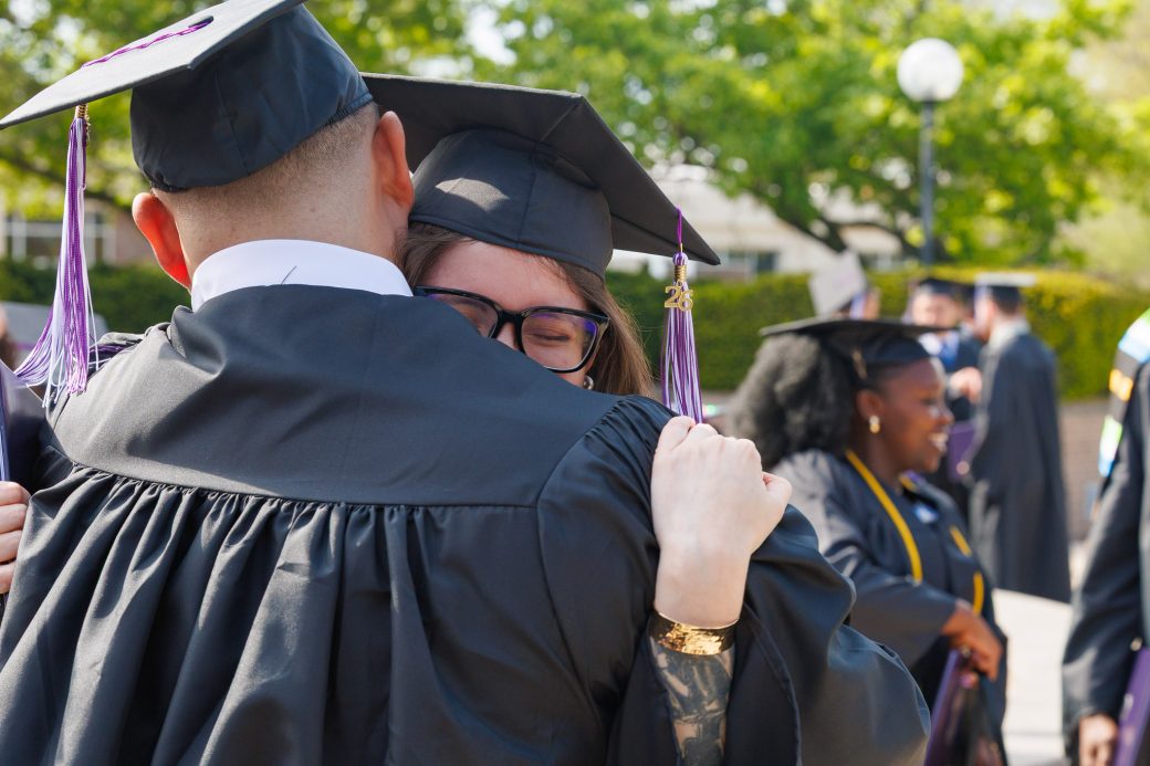 Grad students hugging