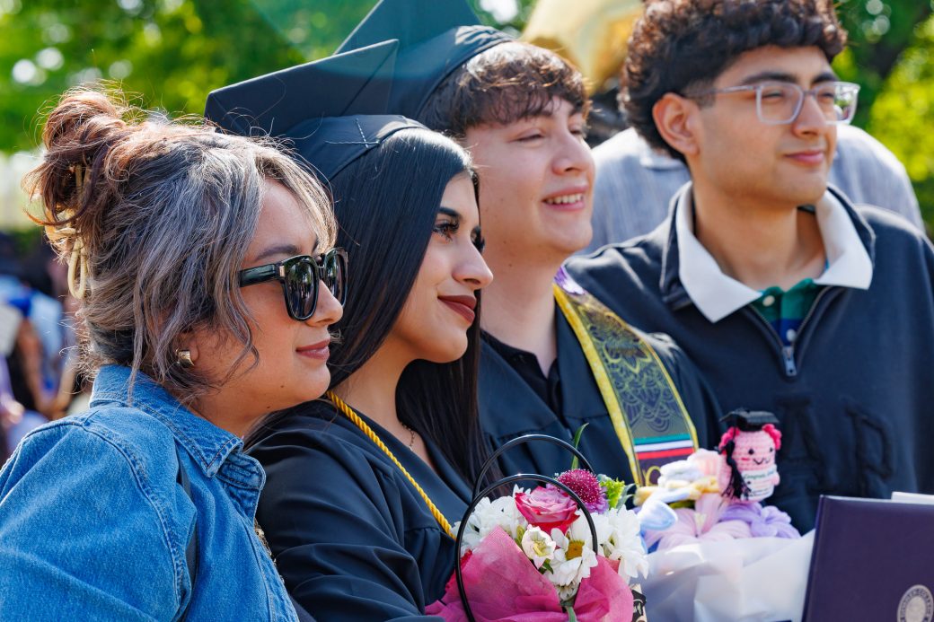 Graduate posing with family