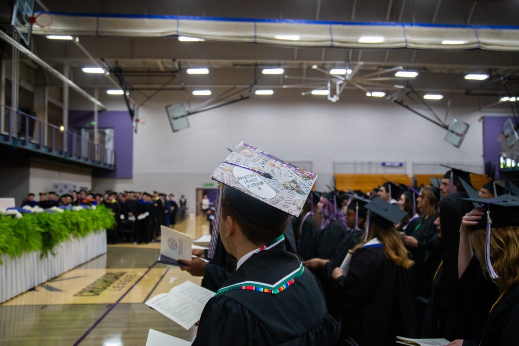 Students singing during final benediction at graduation ceremony