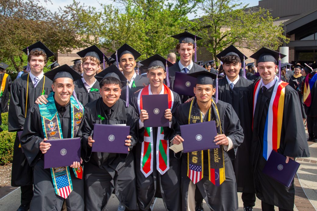 Group of graduate friends with diplomas