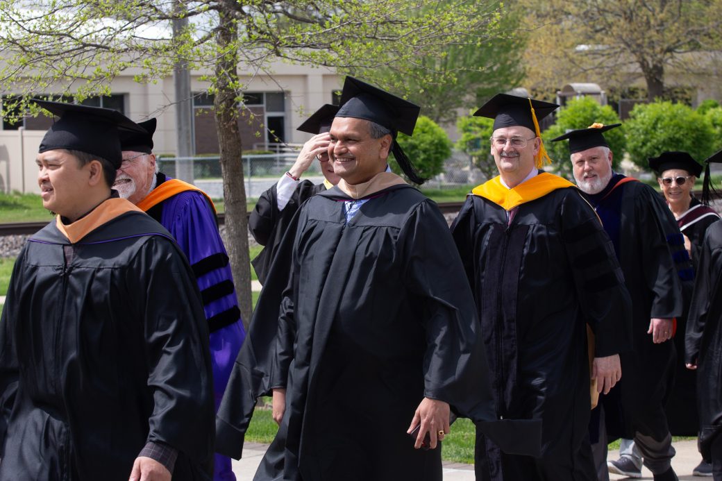 Raj Biyani walking in graduation processional