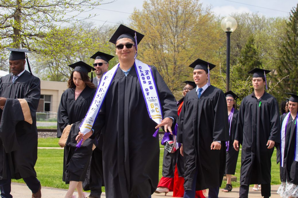 Student showing off graduation stole
