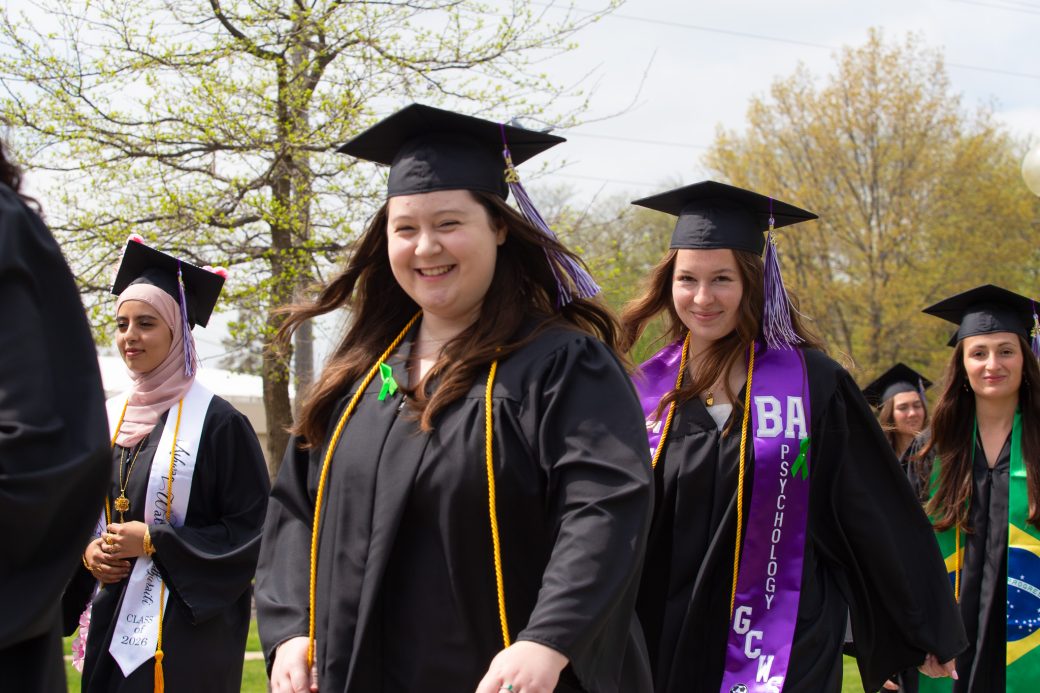 Female graduate smiling big