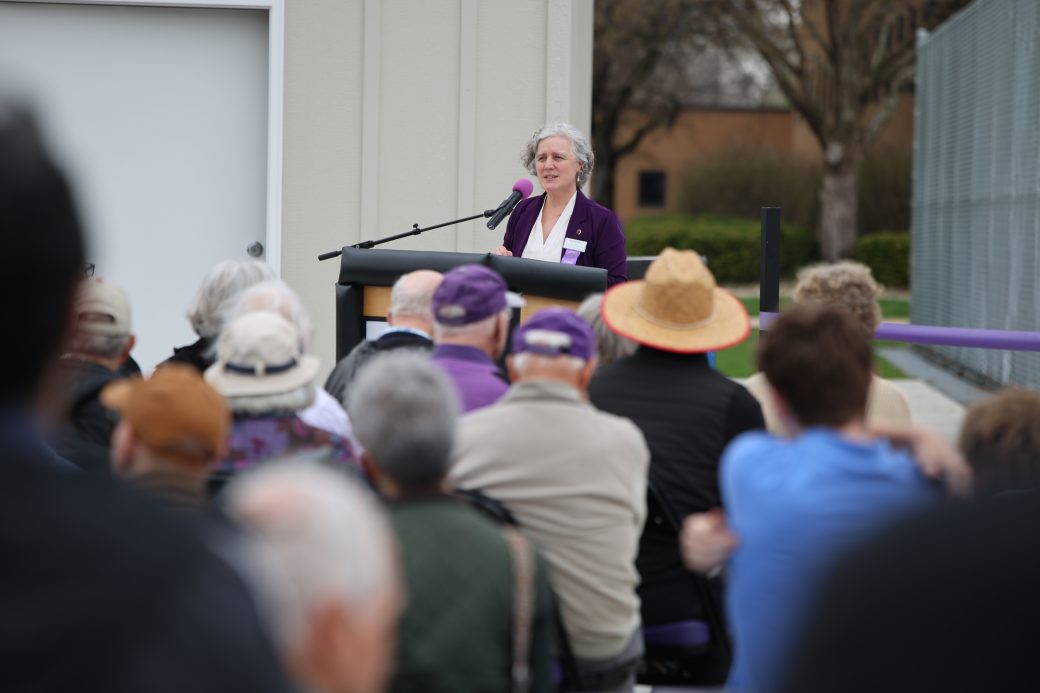 Vice President Jodi Beyeler speaking and crowd
