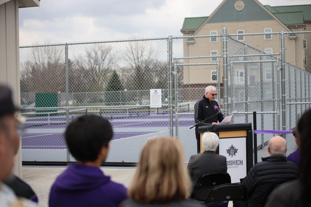 Athletic Director Dwight Gingerich speaking and crowd