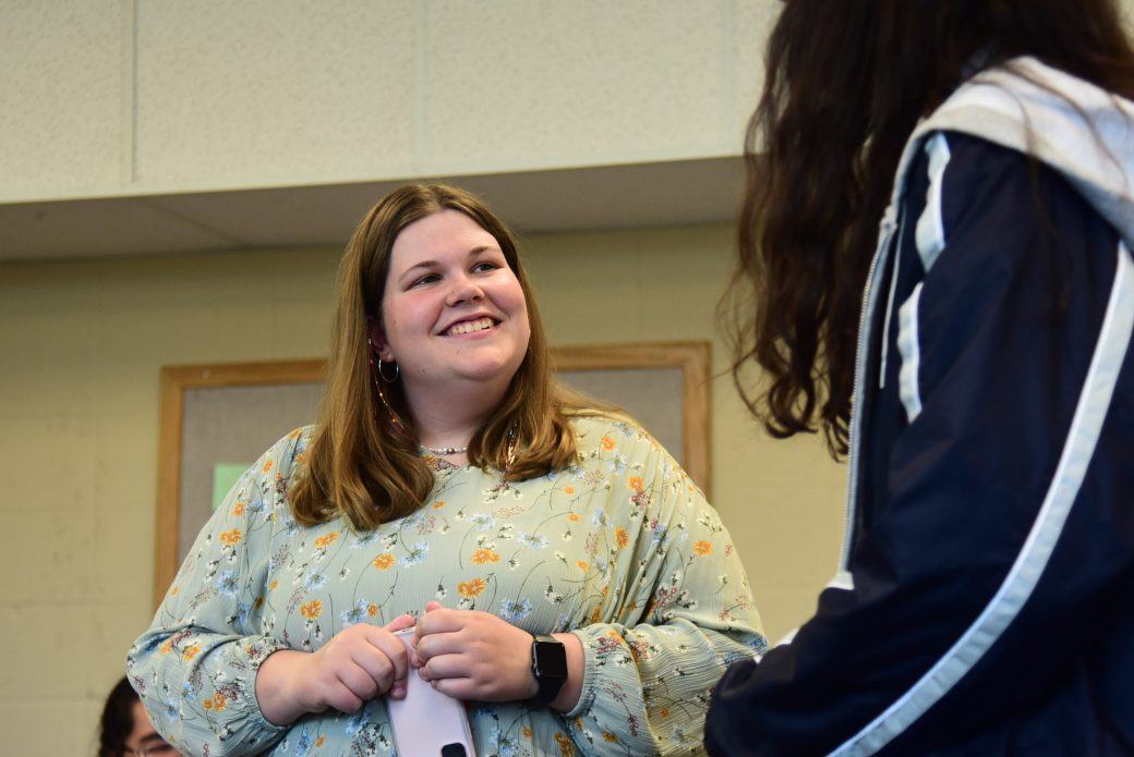 Close up of student smiling at academic reception