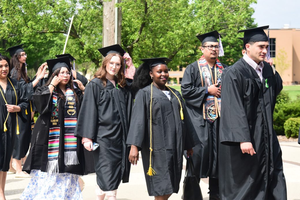 Group of graduates walking into Roman Gingerich Recreation-Fitness Center