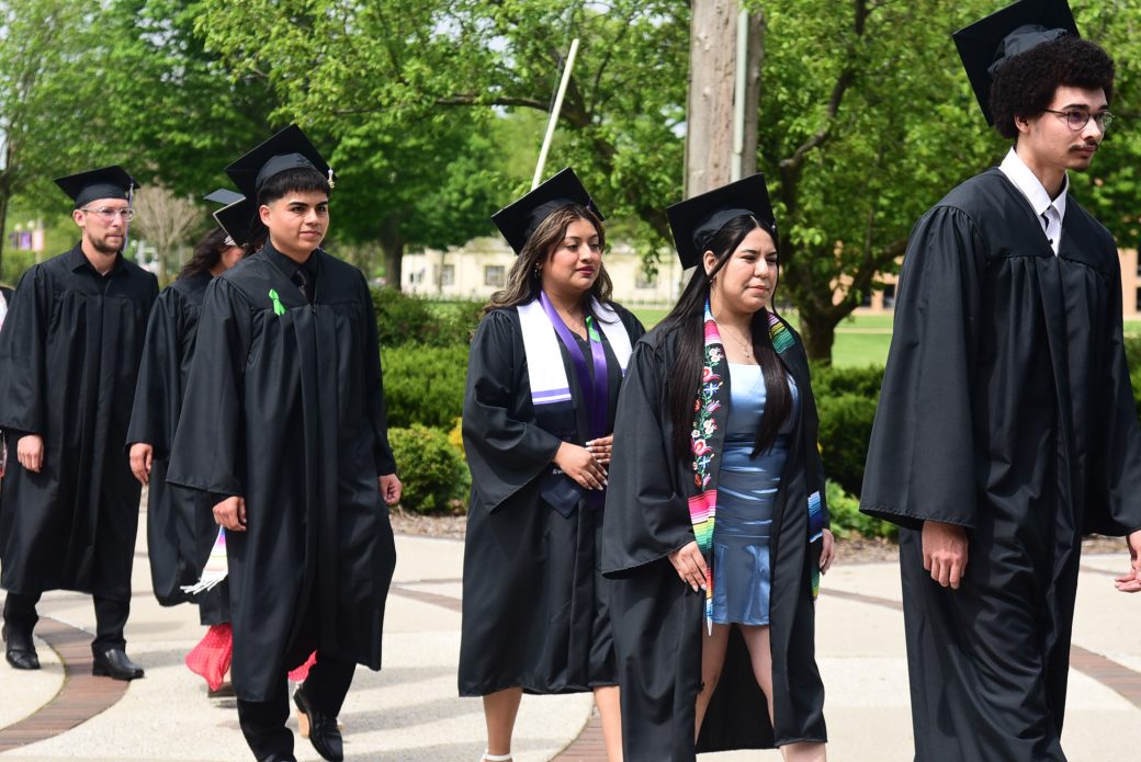 Group of graduates lined up waiting to go into Roman Gingerich Recreation-Fitness Center