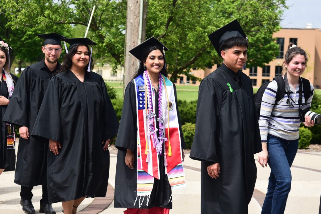Latina graduate wearing a stole representing her heritage during commencement