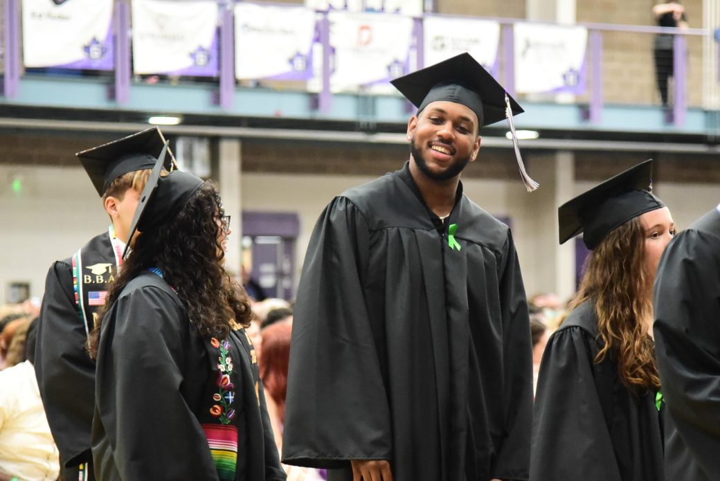 Graduates leaving the ceremony in a celebratory processional