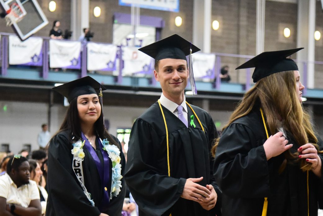 Graduates walking out of ceremony in organized processional