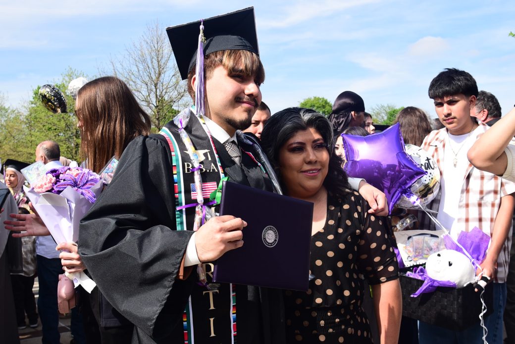 Graduate posed with family outside