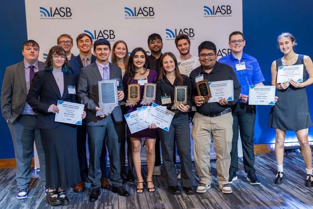 lots of students smiling and holding awards