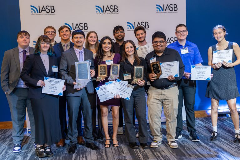 lots of students smiling and holding awards