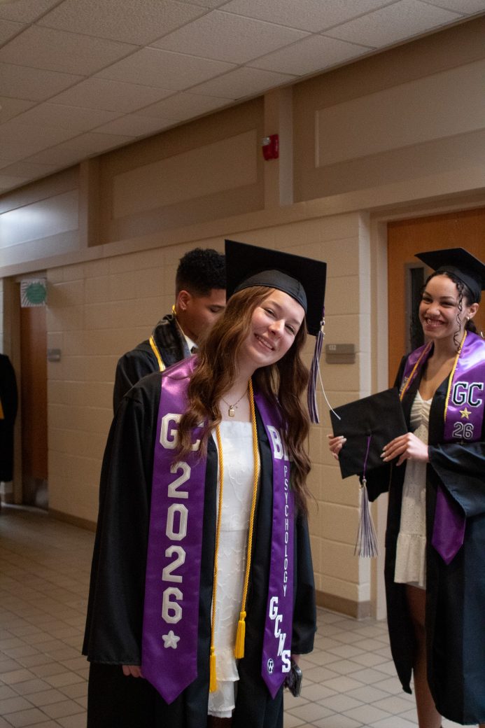 Female graduate student smiling at camera