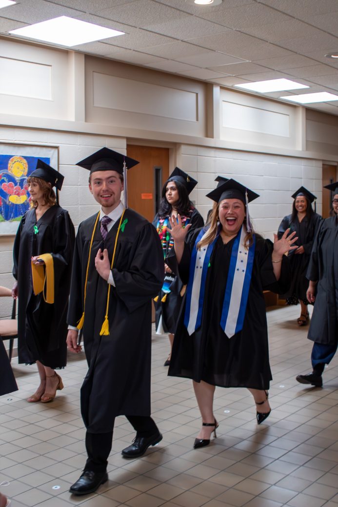 Excited graduates smiling for photo