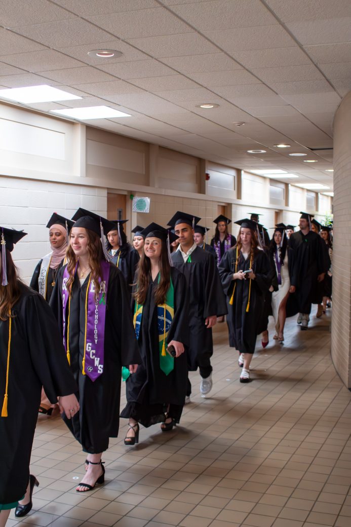 Graduates about to leave for their walk to graduate