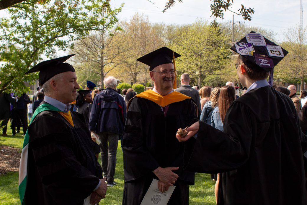 Faculty and staff gathered on lawn