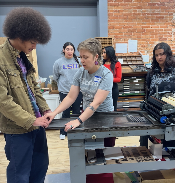 students exploring a letterpress