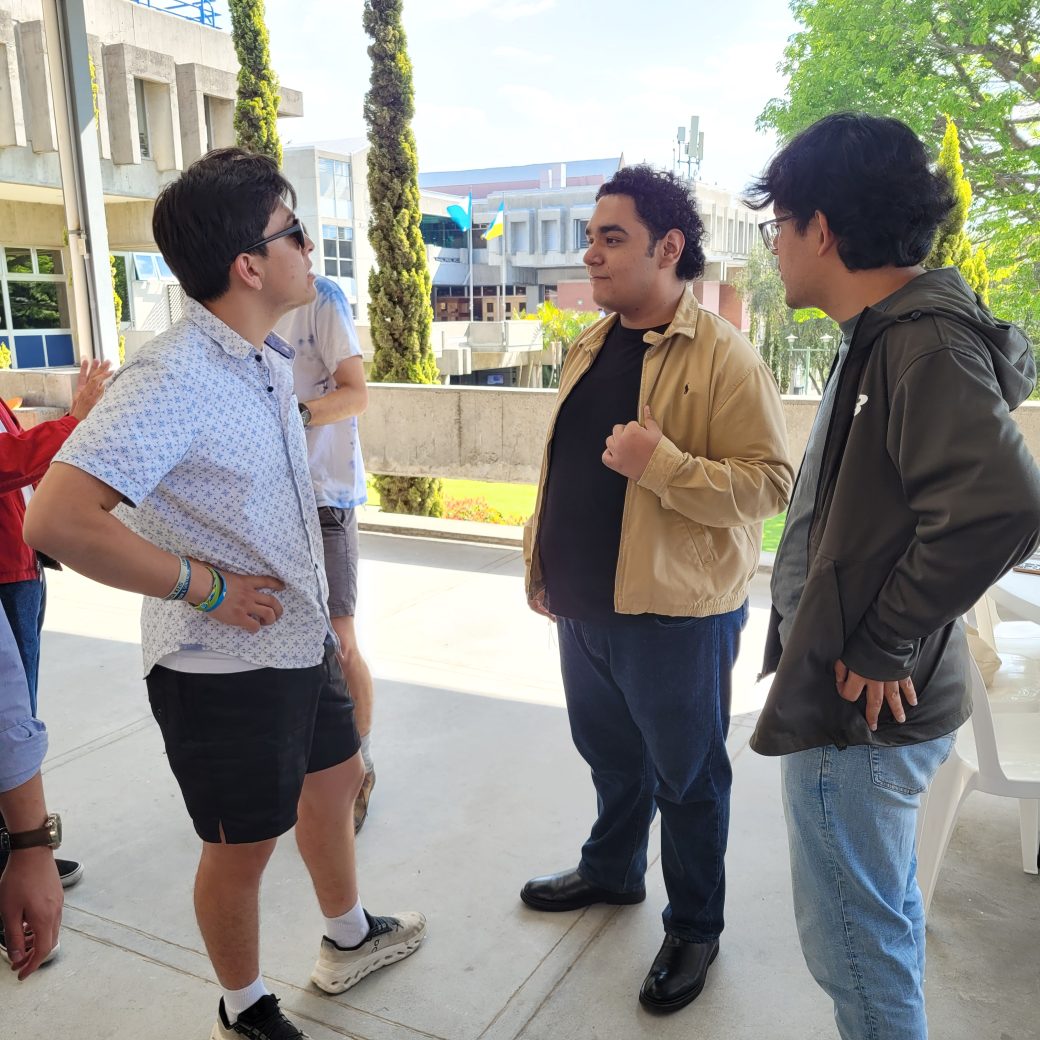 A group of people talking at a table.