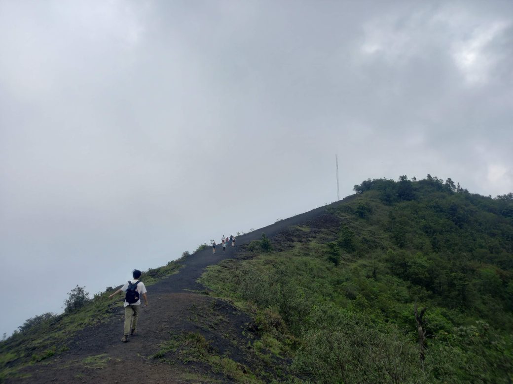 A mountain peak with one hiker.