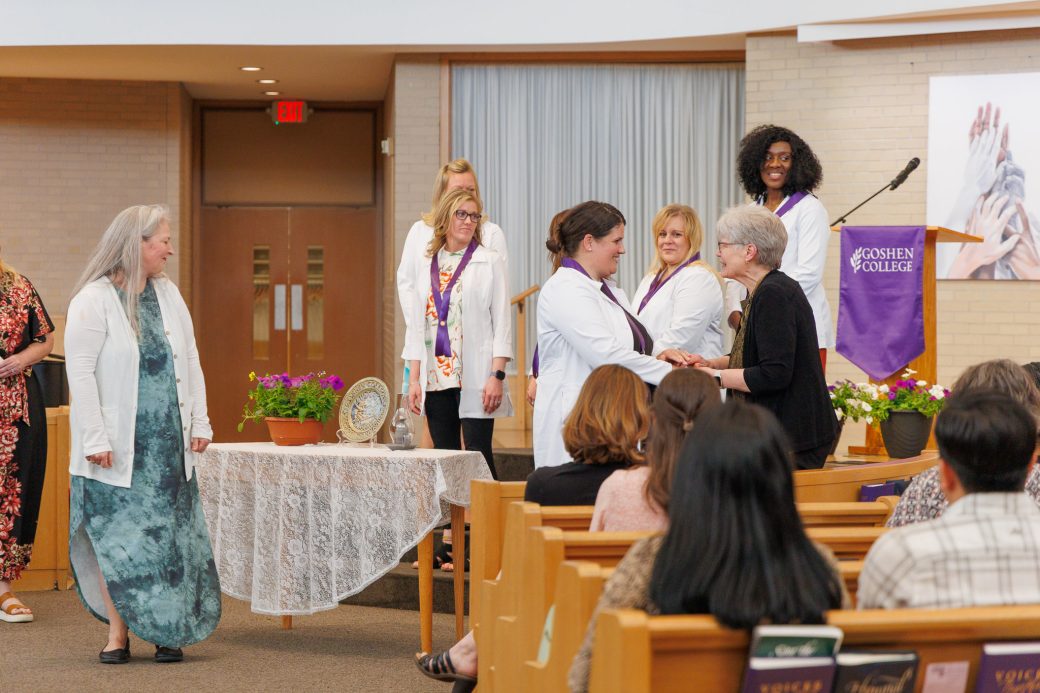 MSN graduate receiving handshake