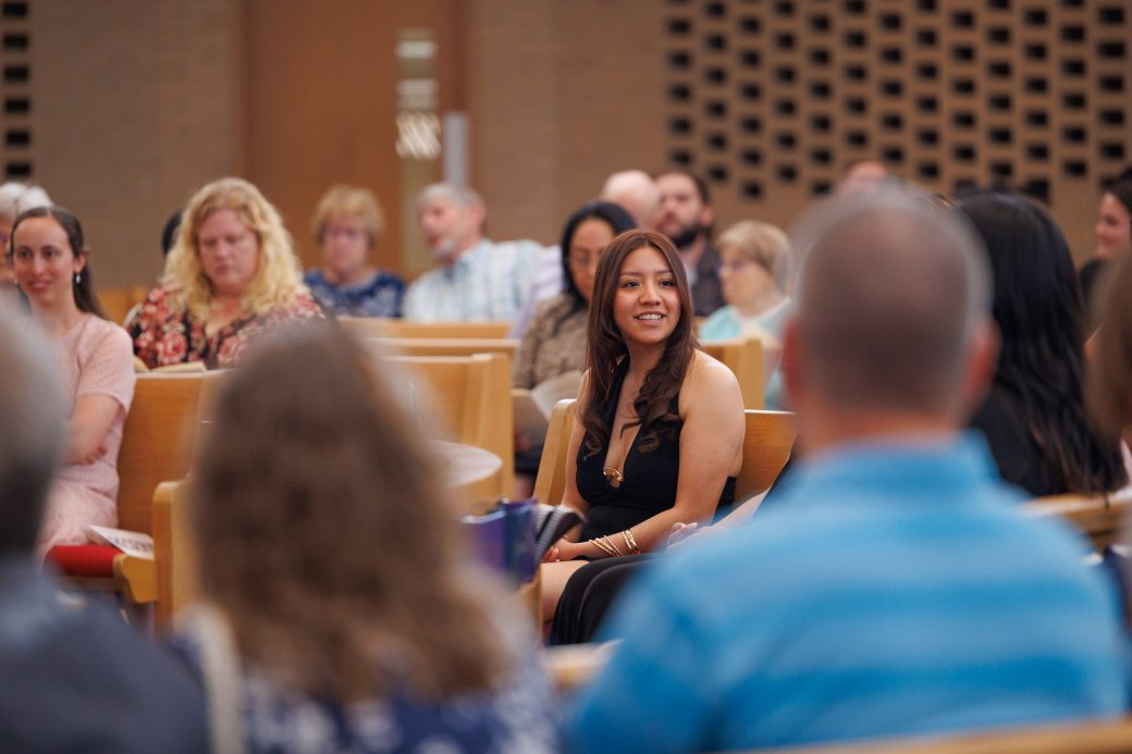 Close up of student looking onward in the audience