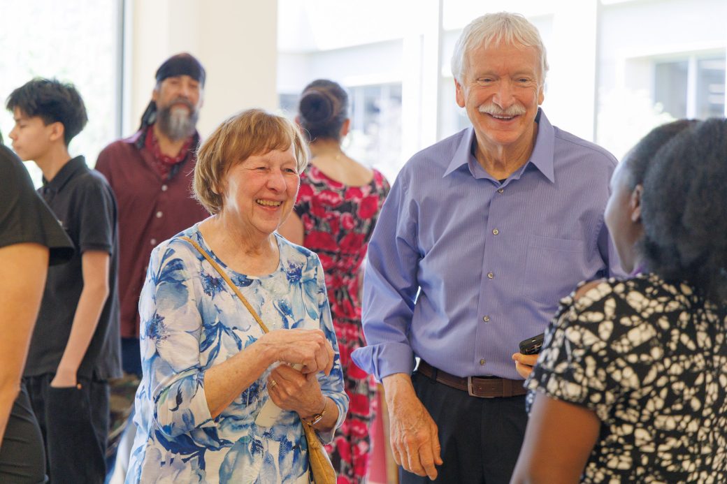 Elderly couple smiling at msn graduate