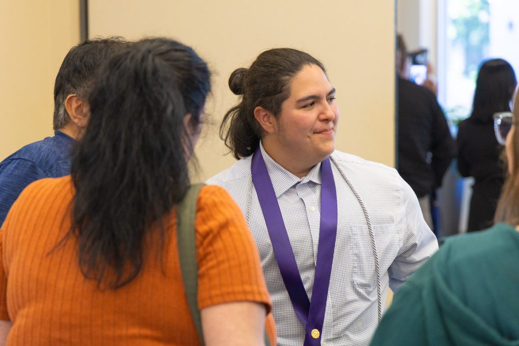 Nursing grad talking with family and friends