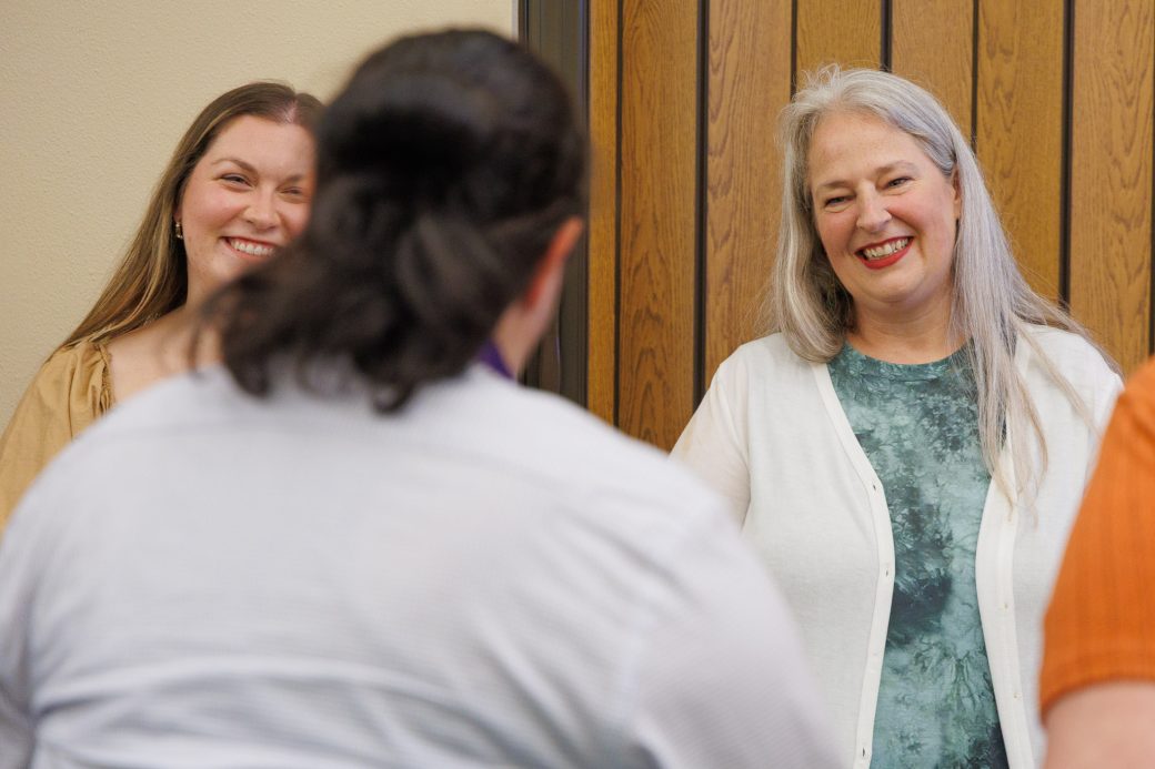 Goshen College nurse faculty smiling at student