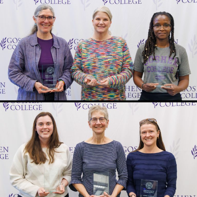 Employee awardees holding their awards