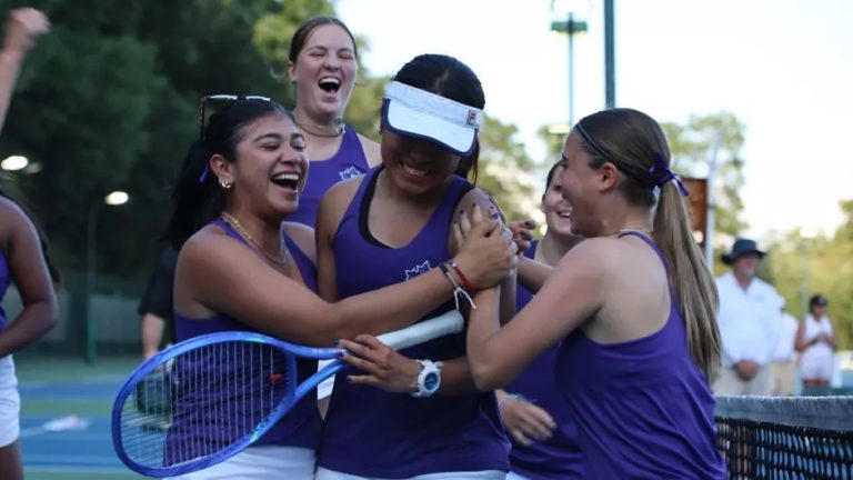 tennis players hug each other and smile