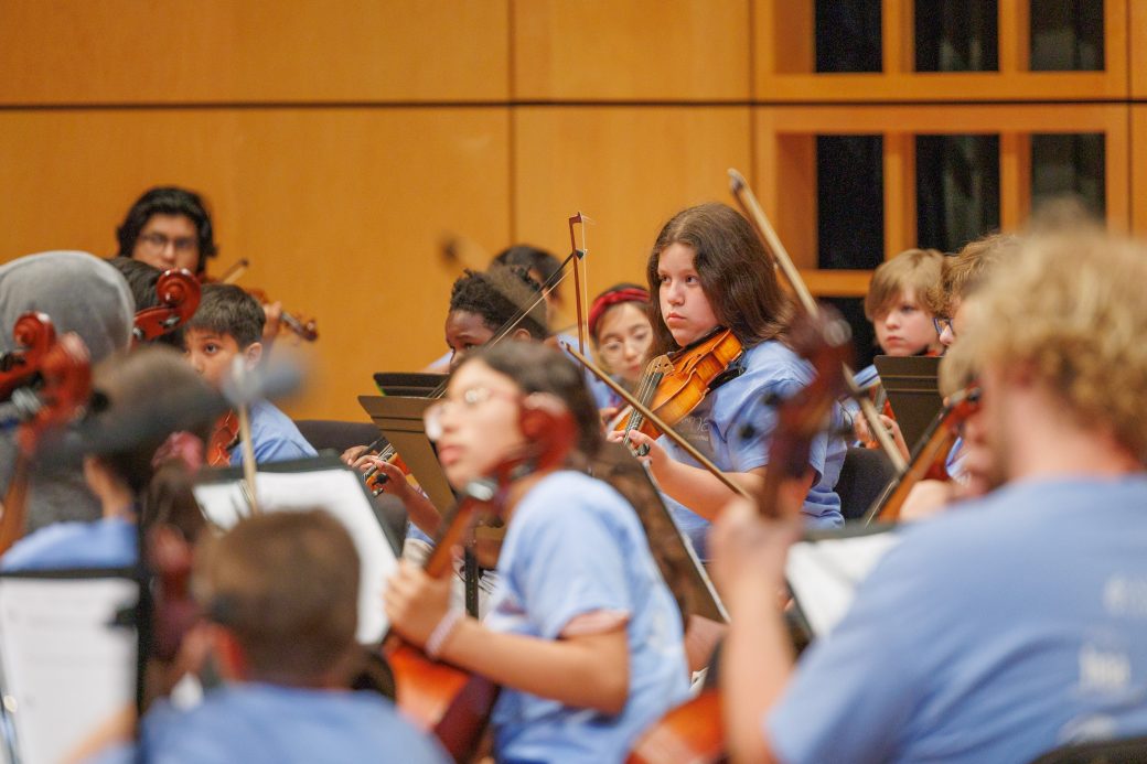Close up of student playing violin